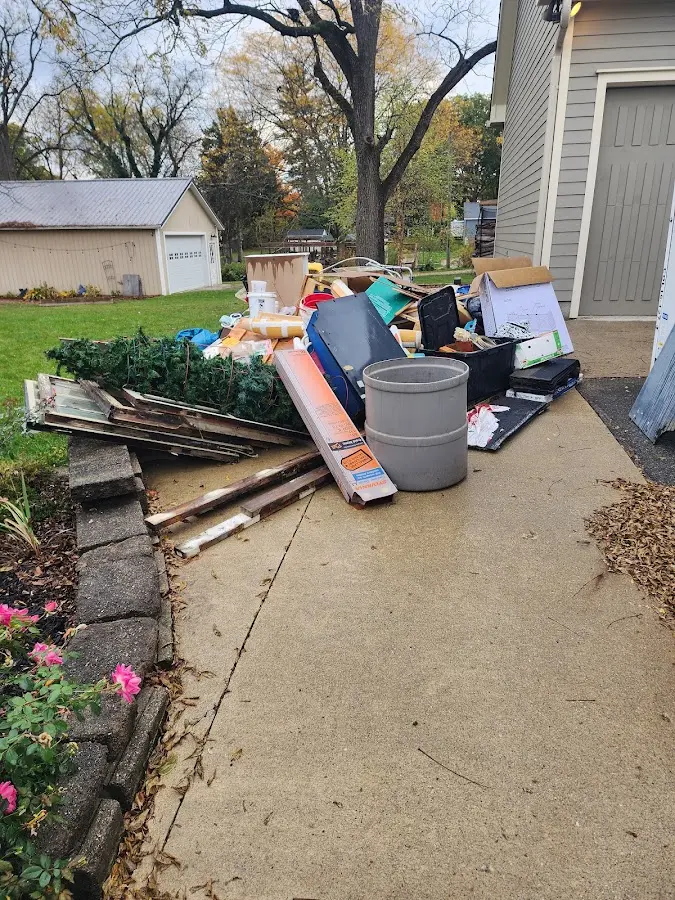 Dumpster being loaded with debris for 10 Yard Dumpster Rental in Hardyston